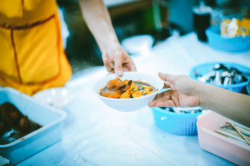 The concept of helping by providing food to the needy in the community.