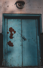 Metal door with vintage handles and rust with space for text