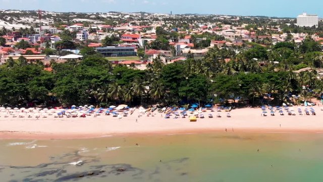 Drone fottage travelling from left to right showing the shore ande the Itapu&atilde; district at the background in Salvador Bahia Brazi