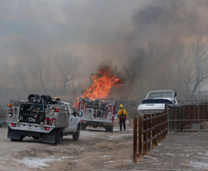 Firefighter Surveys a Wildfire