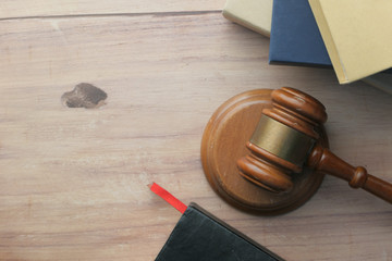 Close up of gavel , book and handcuff on table 