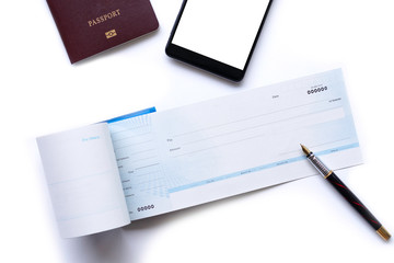 Travel concept. Checkbook, pen, mobile smart phone with empty white screen and passport mock up...