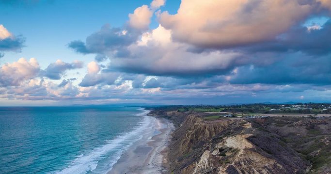 Aerial time-lapse of clouds rolling over ocean bluffs in La Jolla, California