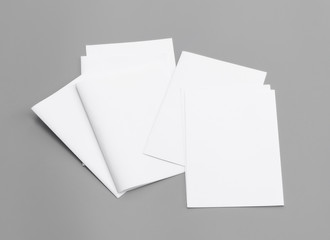 Blank portrait A4. Mock-ups white paper isolated on gray background. can use banners magazine products business texture newspaper.