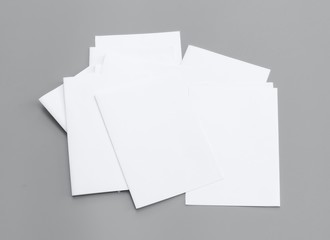 Blank portrait A4. Mock-ups white paper isolated on gray background. can use banners magazine products business texture newspaper.