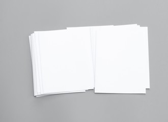 Blank portrait A4. Mock-ups sheets white paper isolated on gray background. can use banners magazine products business texture newspaper.