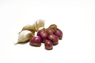 Fresh shallots and garlic against a background of white isolates.