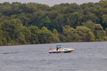 Fototapeta na wymiar Boat on Lake in Water 