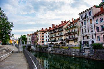 Fototapeta na wymiar View to the shores and the river Ljubljanica in the center of city of Ljubljana during nice summer day