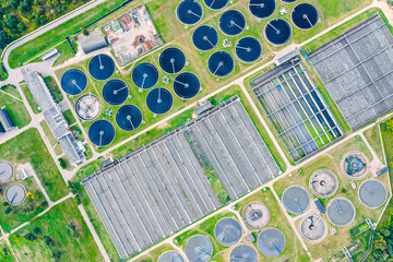 aerial top view of round water settlers for sewage recycling. modern wastewater treatment plant