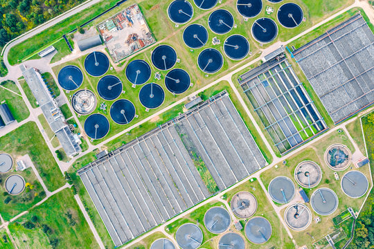 Aerial Top View Of Round Water Settlers For Sewage Recycling. Modern Wastewater Treatment Plant