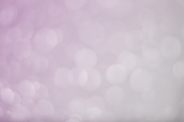 Abstract bokeh light sparkle on pink background