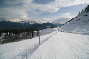 Fototapeta na wymiar View of the Caucasus mountains and ski slopes of the resort, Sochi, Russia.