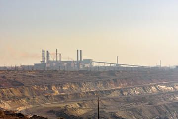 View on iron ore quarry in a dust haze