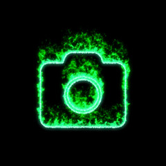 The symbol photo camera burns in green fire