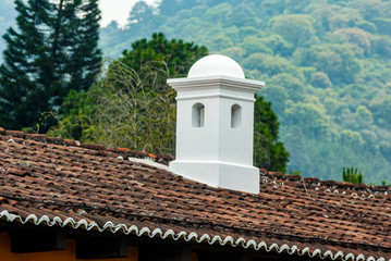 Smokestack detail in colonial house of La Antigua Guatemala, in Central America, Spanish heritage, outdoor architectural detail usually made of brick and tiles.