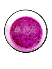 A glass of red dragon fruit juice