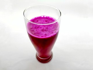 A glass of red dragon fruit juice