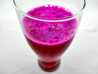 A glass of red dragon fruit juice