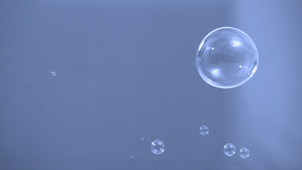 Soap or shampoo bubbles floating in the air by wind blow which represent refreshing and relaxing or...