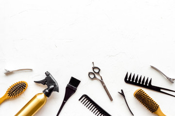 Beauty saloon accessories - combs, sciccors for hairdressing - on white background top-down frame copy space