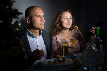 Cheerful couple celebrating New Year