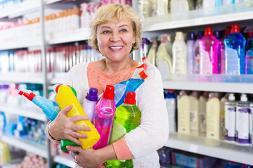 Female holding goods for cleaning in household store