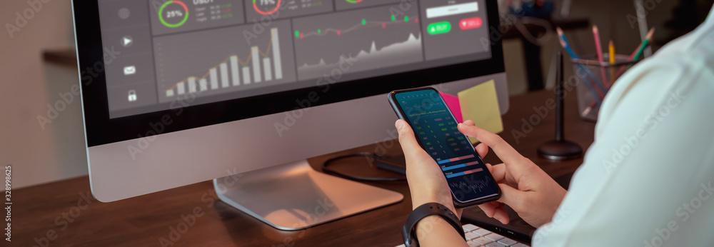 Poster stock exchange market concept, businesswoman trader looking on smartphone and computer with graphs a