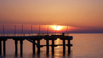 Fototapeta na wymiar Sea pier in the sea at sunset