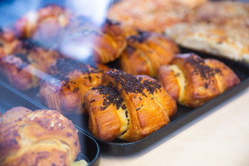 Various croissants in pastry shop