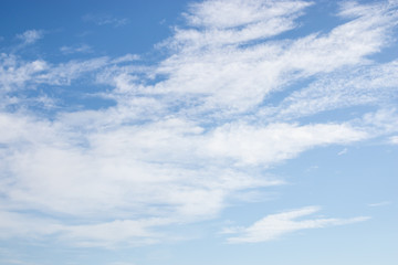 White fluffy clouds on bright blue sky