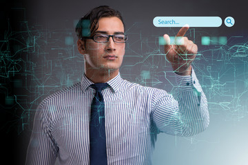 Search concept with businessman pressing button