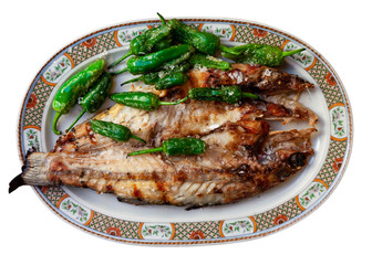 Grilled bass with Padron peppers