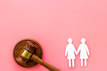 Discrimination concept. Judge gavel, female couple on pink background top-down copy space