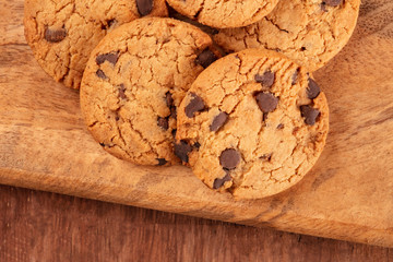 Chocolate chip cookies close-up on a rustic wooden background