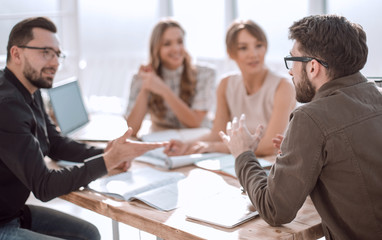 business partners hold a dispute at a meeting in the office
