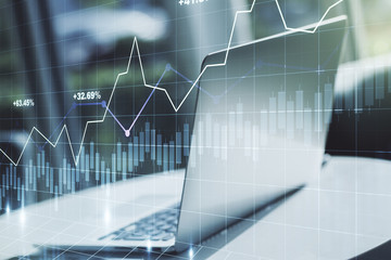 Abstract creative financial graph on modern laptop background, financial and trading concept....