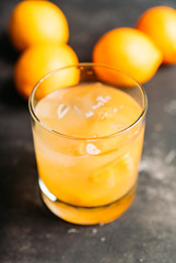 Old fahioned lemon beverage on the rustic background. Selective focus. Shallow depth of field.
