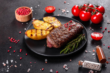 Ribeye steak with potatoes, onions and cherry tomatoes