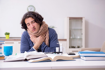 Sick male student suffering at home