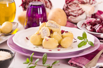 Potato gnocchi stuffed with radicchio and ricotta.