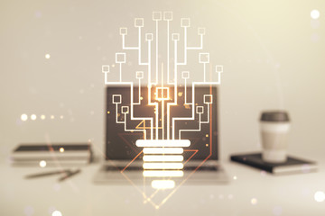 Fototapeta premium Creative light bulb with chip hologram on modern laptop background, artificial Intelligence and neural networks concept. Multiexposure