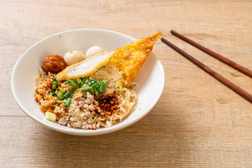 spicy noodles with fish ball and minced pork (Tom Yum Noodles)