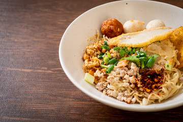 spicy noodles with fish ball and minced pork (Tom Yum Noodles)