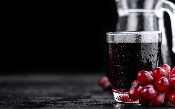 Red Grape Juice (selective focus; detailed close-up shot)