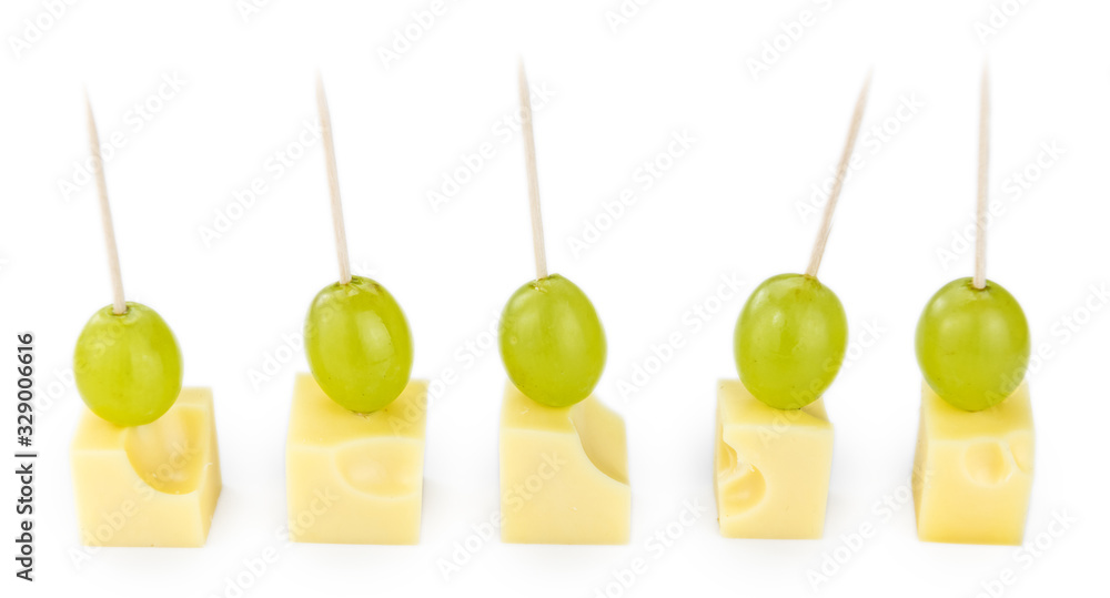 Sticker Cheese blocks with grapes isolated on white