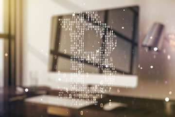 Double exposure of creative Bitcoin symbol with modern laptop on background. Cryptocurrency concept
