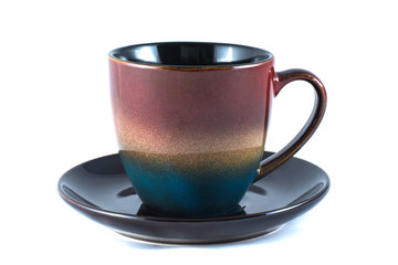 close-up beautiful colorful ceramic cup with saucer isolated on white background