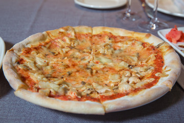 italian style pepperoni pizza with mushrooms . fried potatoes. ketchup