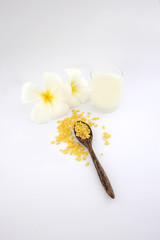 Top view soy bean overflowing spilling wooden spoon and milk  are on white background and isolated.